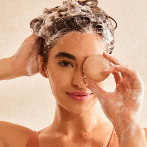 girl holding the Revitalizing Shampoo Bars